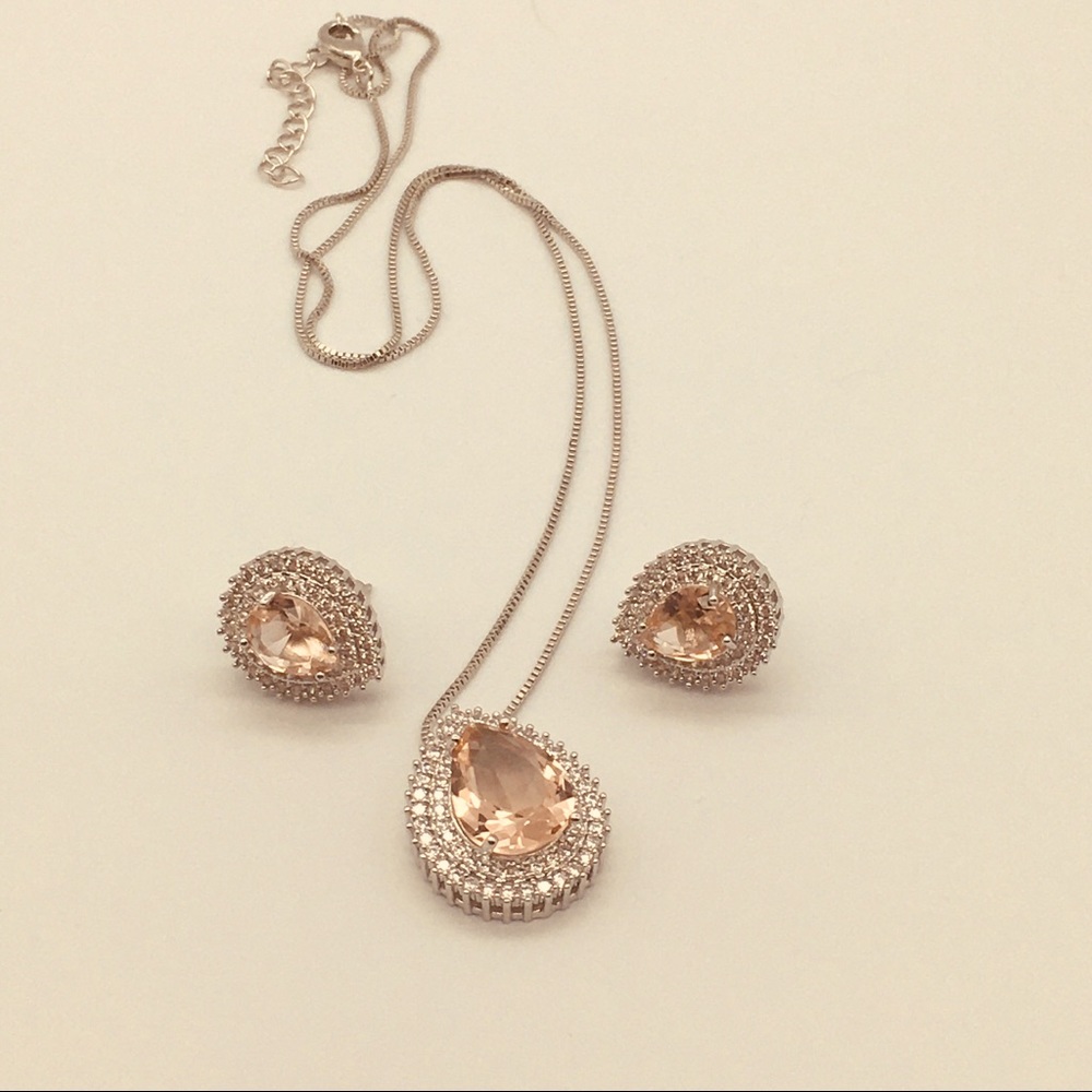 Earrings and necklace with “ peach “ crystal